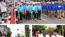 Photo atas: Bupati Jombang mengibarkan bendera start untuk memberangkatkan peserta Gerak Jalan ROJO 2026. Photo bawah kiri: Ketua Tim Penggerak PKK Yuliati Nugrahani Warsubi mengankat bendera start. Selanjutnya, photo kanan bawah: Bupati Warsubi bersama para pejabat yang hadir turut berjalan menyusuri sebagian rute Gerak Jalan ROJO 2026, tampak Wakil Bupati (depan kanan) menyempatkan diri menyapa warga yang hadir menyaksikan kegiatan ini.